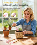 Woman using mini tools for indoor gardening on a wooden table beside potted plants, focusing on strength and durability features.