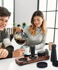 Professional 13 Piece Espresso Kit featuring 51 mm tamper and WDT tool, with tools on a wooden brew mat during coffee preparation.