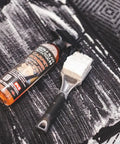 Carpet Bomber Upholstery Cleaner Citrus Power That Lifts Grease Dirt And Odors Tough Grime Be Gone shown cleaning car mat