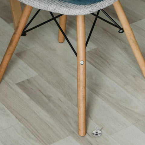 Close-up of a chair leg next to 10 Pack Screw On Iron Furniture Feet M6 For Beds Couches Tables And Dressers White Simple Classic Decorative Legs