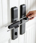 Hand installing Beefy U Shaped Portable French Door Lock For Double Doors With Handles And Knobs All Metal Security Lock