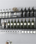 Top Shelf Wall Mounted Wine Rack With Dual Tier Wood And Metal Shelves For Bottles And Glasses Hella Ready Home Bar Display Stand That Knocks It Out Holding Your Liquor Collection In Matte Black with wine bottles and glasses.