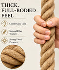 Close-up of hand holding heavy duty natural jute rope 1.5 inch thick, 100 feet long for docks, nautical decor, railings and swings