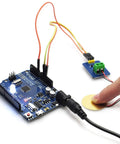 Analog Piezo Vibration Sensor Module for Arduino DIY Kit Plug And Play Ceramic Piezo Disc With Analog Output Dope For Prototyping Robots And Vibration Sensing Projects Case Pack Of Five EK1952 connected to Arduino with fingertip tapping disc