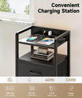 Modern nightstand with charging station, USB ports, AC outlets, and LED light strip; storage shelf and fabric drawers visible; smart bedroom use.