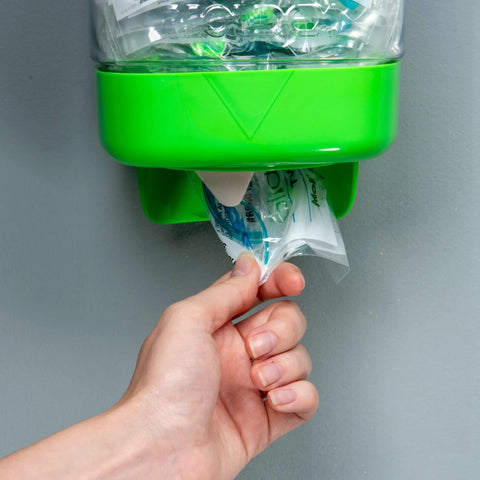 Hand dispensing from Glide Soothers Earplug Dispenser Corded Foam Twist Push In Moisturized Earplugs NRR 31dB 6886