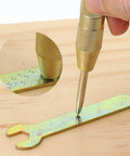 Workhorse 5 Inch Automatic Center Punch Pair Spring Loaded Adjustable Impact marking metal on wood, detailed close-up of tool action.