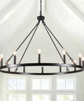Wagon Wheel Farmhouse Chandelier In Black And Wood, 6 Light Rustic Industrial Pendant Light Fixture in a bright room.