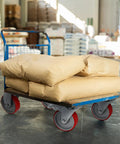Beefy Four Inch Caster Wheel Set With Two Locking Brakes And Two Rigid Rollers Tough Steel Frame grunting under heavy loads in warehouse cart.