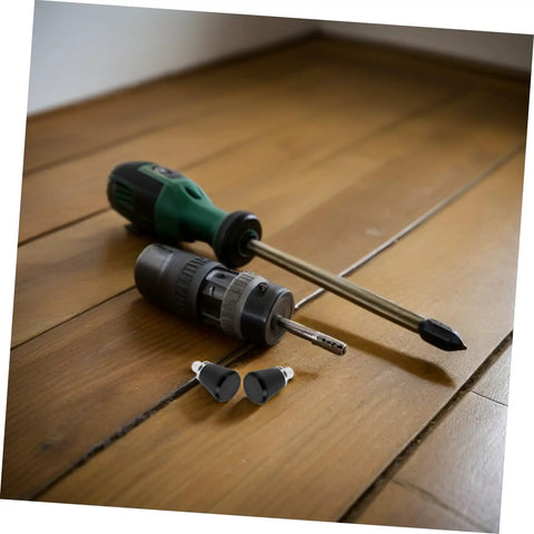 Heavy Duty 4 Pc Set Black Mechanical Spring Pins With Wear Resistance For Industrial Workshop Use And Reliable Smooth Operation Plus Super Stable Reset Power On Locating Pins To Keep Your Setup Rock Solid No Drift Amidst Vibration Ever next to a green screwdriver and drill on wooden floor.