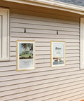 Heavy Duty Slatwall Notch Hook Set holding photo frames on a house exterior, Stainless Steel Slat Wall Hangers For Photo Frames And Artwork