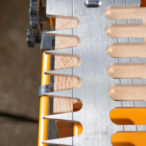 Close-up of a 12 Inch Dovetail Jig With Templates, Router Bits, And Guide Bushing For Half Blind And Through Dovetails, Box Joints