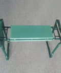 Garden Kneeler And Seat Heavy Duty Portable Folding Bench with soft foam pad, green metal frame shown folded