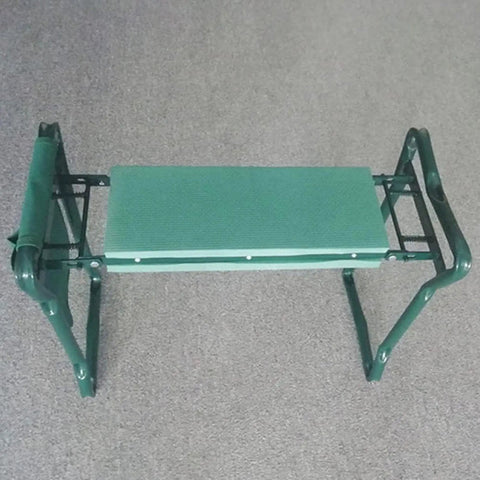Garden Kneeler And Seat Heavy Duty Portable Folding Bench with soft foam pad, green metal frame shown folded