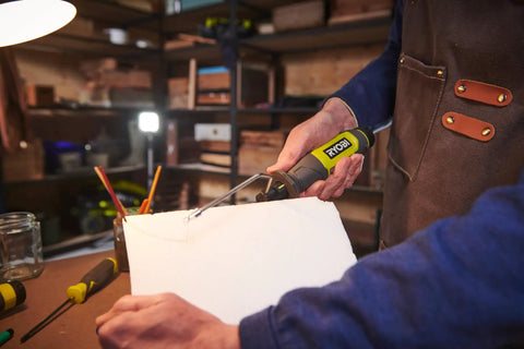 A person using a 4V Cordless Hot Foam Cutter With 2.0Ah Battery for model making, shaping foam efficiently.
