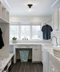 Industrial Semi Flush Mount Ceiling Light with Clear Glass in Black Finish installed in a modern laundry room.
