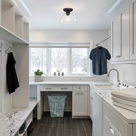 Industrial Semi Flush Mount Ceiling Light with Clear Glass in Black Finish installed in a modern laundry room.