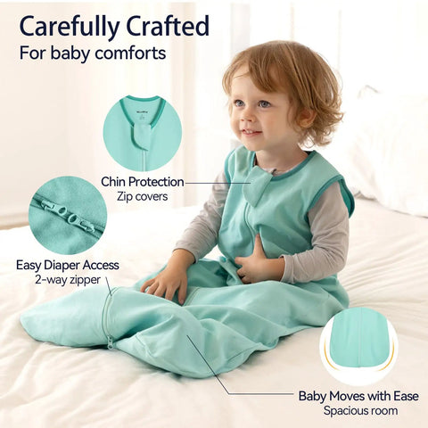 Child wearing Comfy 3 Pack Baby Sleep Sack For 6 To 12 Months 100 Percent Cotton 0.5 Tog Wearable Blanket in mint green with zipper.