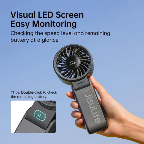Person holding 3 In 1 Handheld Fan With 5000mAh Battery, 12 Blade Brushless Motor Power, LED display showing 100% battery, black color.