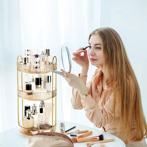 360 Smooth Spin 3 Tier Makeup Organizer For Bathroom Counter Or Vanity Styling with glass bottles and a woman applying makeup.