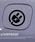 Badass Waterproof Reflective EV Charging Port Sticker Black Electric Plug Vinyl Decal visible on wet surface highlighting waterproof feature.