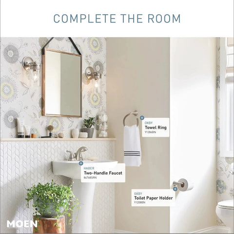 Spot Resistant Brushed Nickel Two-Handle 4-Inch Centerset Bathroom Faucet for 3-Hole Sinks with Aerated Water featured in a modern bathroom.
