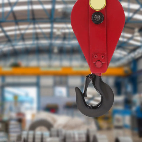 Beefed Up Heavy Duty Lifting Cable Pulley Block For Hauling And Towing Half Ton Capacity Side Opening Design 360 Degree Rotatable Hook Iron Wire Rope Crane Pulley Wheel Smooth Operation And Easy Load Handling red pulley block with black hook in workshop