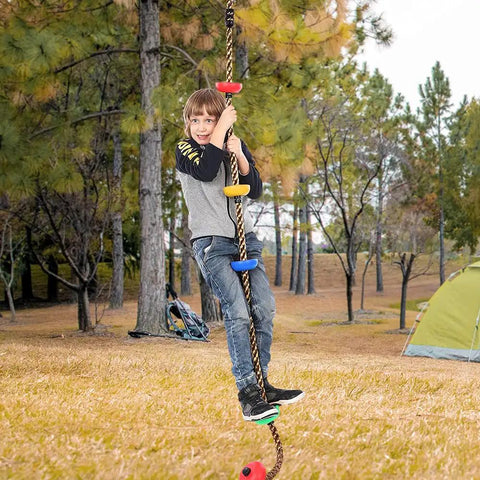 Child playing on 6.56 Foot Climbing Rope Swing With Treads And Plate Swing Hanging Kit For Trees, outdoor usage shown