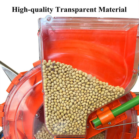 Close-up of Hand Push Seeder With Wheels, transparent dual seed and fertilizer hopper, filled with soybeans for lawn and garden planting