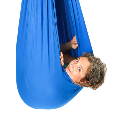 Blue 95 Percent Cotton Sensory Swing For Kids X Large Therapy Swing With Deep Pressure Support For Autism SPD And Anxiety Calming Cozy Swing With 4 Way Stretch Fabric Hardware Included, child inside blue cocoon swing