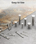 Beefed Up Heavy Duty Stainless Steel Clevis And Clip Kit With Organizer Box 122 Pcs, showing clevis pins and cotter clips on surface