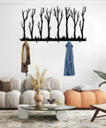 Rustic Winter Tree Grove Metal Wall Hooks in minimalist design holding jackets in stylish entryway decor.
