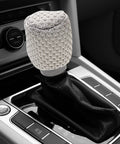 Get That Fresh And Breezy Fit With This Super Durable Gear Shift Knob Cover Kit Plus Breathable Brake Handle Grip Sleeve Made For Ultimate Comfort And Long lasting Style In Your Ride. gray knit shift knob cover on black leather gear selector