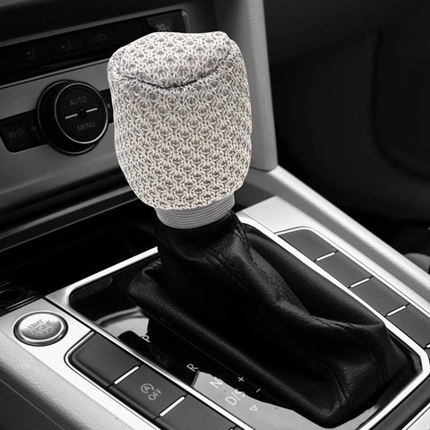 Get That Fresh And Breezy Fit With This Super Durable Gear Shift Knob Cover Kit Plus Breathable Brake Handle Grip Sleeve Made For Ultimate Comfort And Long lasting Style In Your Ride. gray knit shift knob cover on black leather gear selector