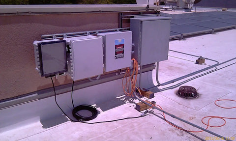 Built Like A Tank Polycarbonate Enclosure 16 X 14 X 8 Inches installed with solar equipment on a rooftop