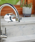 Chrome Faucet Mount Water Filter With WQA Certified PFOA PFOS And Chlorine Reduction installed on kitchen sink faucet