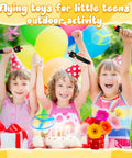 Kids enjoying Disk Helicopter Toy Set With 12 String Launchers And 24 Flying Saucers For Outdoor Fun at a colorful party.