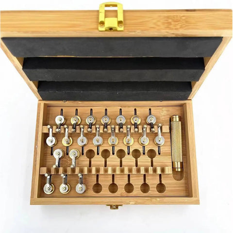 Open wooden box showing the Pro Grade 20 Calibers Watch Mainspring Winder Kit with adapters and copper tools for watch repairs.