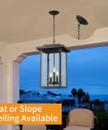 Outdoor Pendant Light Exterior Hanging Lantern In Matte Black With Clear Seeded Glass Large Porch Light lit on patio