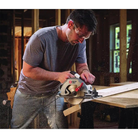 Worker using Heavy Duty 7-1/4 Inch Circular Saw With 15 Amp Motor Delivers 5500 RPM Magnesium Shoe And Metal Guards For Durability