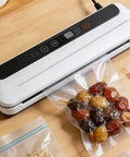 4 Pack Vacuum Sealer Heating Strips Nichrome Wire Replacement 450mm X 3mm on a sealing machine with vacuum-sealed food.