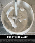 Pro Grade Paint And Drywall Mud Mixer With Extra Long 28 Inch Shaft And 4 Inch Paddle Head Patent Pending Splatter Free Operation And Reduced Drag On Your Drill Heavy Duty Drill Attachment For Smooth Finishes On The Job being used in a bucket of drywall mud.