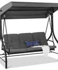 Gray Three Seat Outdoor Canopy Swing Glider with Convertible Flatbed and Adjustable Shade, Weather Resistant Steel Frame.