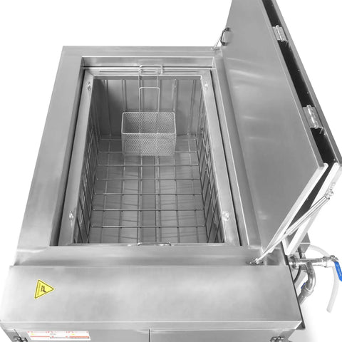 Top Shelf Ultrasonic Parts Washer Uses Rock Solid Three Phase Power To Blast Stubborn Oil Grease And Machining Debris From Metal Tools Providing Consistent Heavy Duty Cleaning For Shop Floors Without Downtime Or Messy Chemicals Killing Your Profit Margins. Stainless steel tank with a mesh basket inside.