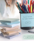 3x3 Inch Sticky Notes 8 Pads Per Pack Dope Vintage Colors beside colored pencils and pen