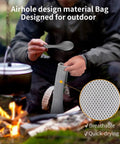 Person with Ultralight Titanium 2 In 1 Fork And Spoon Spork For Camping 2 Pack Eco Friendly Backpacking Utensil by campfire