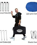 Man carrying Family Friendly Beach Tent Canopy Sun Shade 10x10 Ft Portable Wind Resistant Shelter With Easy Setup And Packable Carry Bag