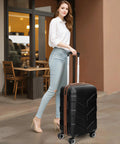 Woman with expandable hardside luggage set featuring spinner wheels and TSA lock, ideal for travel, in a stylish black design.