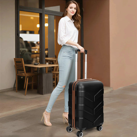 Woman with expandable hardside luggage set featuring spinner wheels and TSA lock, ideal for travel, in a stylish black design.
