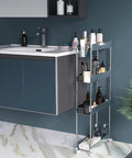 Go-To Slim 4-Tier Rolling Cart With Lockable Wheels And Handy Hooks And Bucket, A Mobile Utility Storage Solution For Office, Kitchen, Laundry, Bathroom And Living Room In Clear Finish placed next to bathroom sink